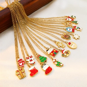 Golden Christmas enamel necklaces featuring Santa, reindeer, and snowman pendants