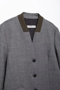 Detail of grey blazer showing contrast knit collar and BBWMWOMAN size label