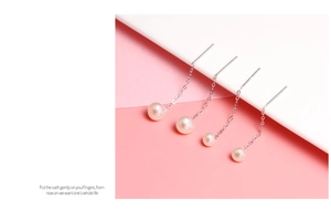 Detailed view of elegant S925 silver long thread earrings with round pink freshwater pearls