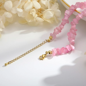 Pink irregular cat eye stone necklace with gold extender chain and lobster clasp