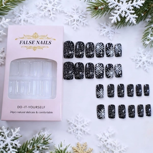 24pcs black press-on nails with white snowflakes in festive winter packaging box