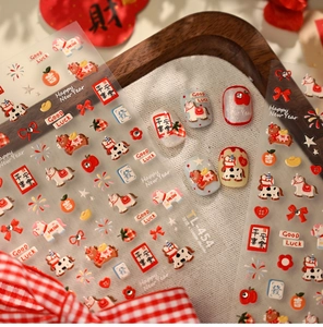 Close-up of festive nail stickers with cute horse and traditional New Year patterns