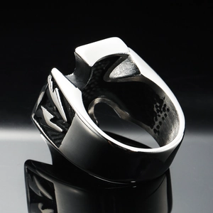 Macro detail of gothic stainless steel ring featuring lightning bolt relief and matte finish