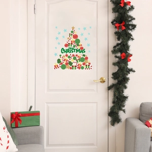 Christmas tree wall sticker with festive ornaments and Merry Christmas text on a white door