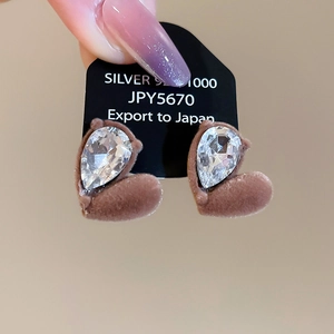 Detail of S925 silver heart earring with brown flocking and sparkling teardrop gem