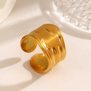 Golden wide wavy chunky ring in stainless steel with irregular geometric texture