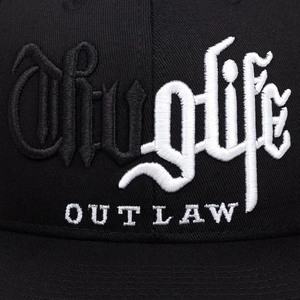 Flat brim cap featuring high-density 3D Thug Life and OUTLAW embroidery in black and white
