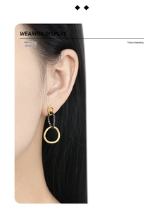 Detailed view of S925 silver triple linked drop earrings with mixed texture on a model