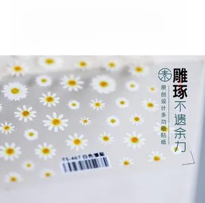Close-up of 5D white daisy flower nail stickers TS-467 on a transparent film sheet
