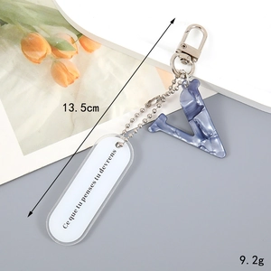 Blue marble acetate letter V keychain detail with 13.5cm length and lobster clasp