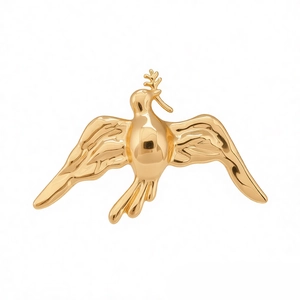 Minimalist gold bird brooch with olive branch in high-polished metal finish