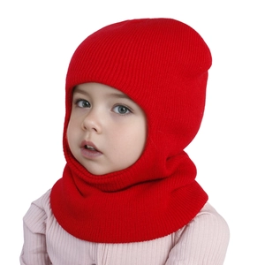 Detailed close-up of a red balaclava-style knit hat for children with ribbed texture