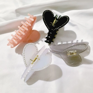 Set di quattro mollette per capelli a cuore in stile francese con strass su tessuto