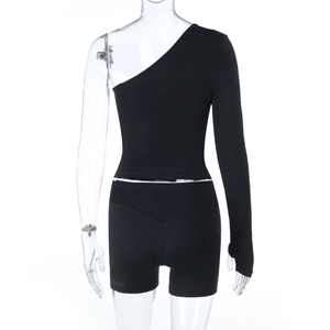 Rear view of black long sleeve off-shoulder top and high waist shorts set on a mannequin
