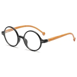 Retro round frame glasses with black front and light brown wood grain temples on white