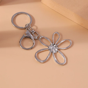 Elegant hollow flower metal keychain in silver finish with lobster clasp and round ring