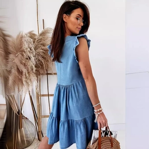 Light blue ruffle denim dress featuring tiered layers and a relaxed A-line silhouette