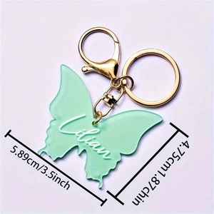 Mint green resin butterfly keychain with custom Lilian text and gold keyring
