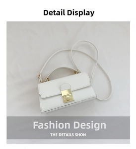Top-down view of cream leather crossbody bag featuring a golden square buckle and strap