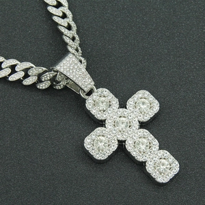 Silver iced out cross pendant on cuban link chain with sparkling rhinestones for men