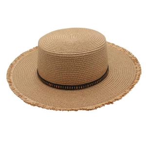 Detail of beaded flat top raffia sun hat with frayed edges and decorative belt trim