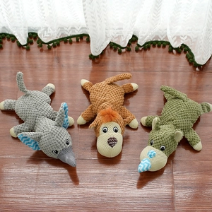 Three squeaky plush pet toys featuring elephant, monkey and crocodile in corn fleece