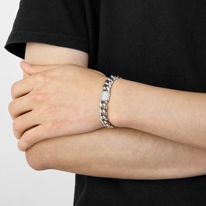 Close-up of 10mm silver Cuban chain bracelet with iced out CNC diamond buckle on wrist