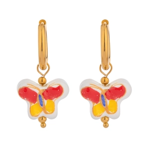 Detail view of gold hoop earrings with colorful hand-painted enamel butterfly pendants