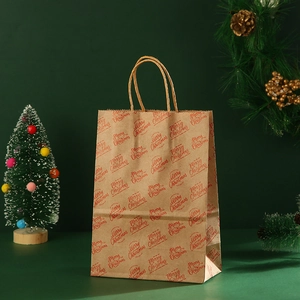 Brown kraft paper Christmas gift bag with red Merry Christmas print and handles