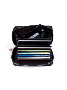 Detailed interior of black accordion card wallet showing multiple slots and gold zipper