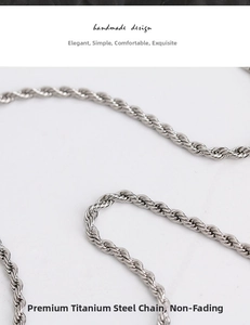 Detail of silver titanium steel rope chain showing twisted texture and metallic luster