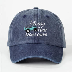 Washed navy denim baseball cap featuring Messy Hair Don't Care text and off-road car design