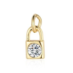 Macro shot of a gold padlock pendant with a sparkling inset clear gemstone centerpiece