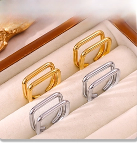 Close-up of gold and silver electroplated PVD ear cuffs in a velvet jewelry box
