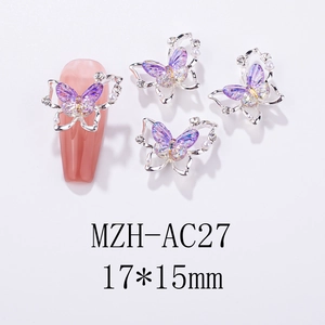 Detailed view of purple aurora butterfly nail charms with silver metal frame and pearls
