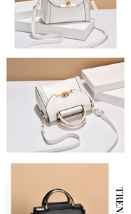 Detail of elegant leather handbags with woven contrast stitching and gold ring hardware