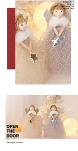 Detail of Christmas angel dolls with gold and silver mesh skirts and knitted hats