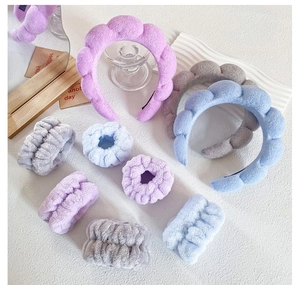 Detailed plush headband and wristband set in soft lavender, blue, and grey velvet