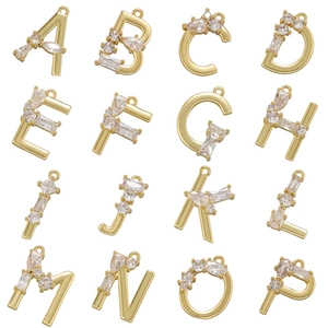 Detailed grid showing 16 gold-plated brass alphabet heart pendants with cubic zirconia
