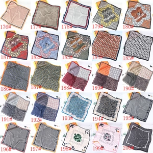 Collage of 25 patterns of square satin silk scarves with paisley and geometric prints