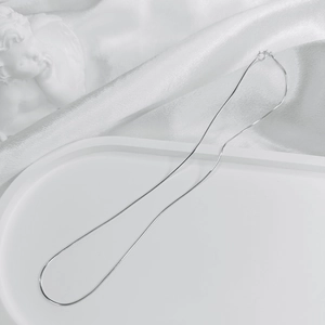 Detail shot of smooth S925 sterling silver snake chain with classic ring clasp