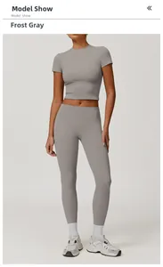 Front full view of female model in frost grey yoga set with crop top and high waist leggings