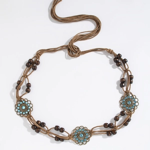 Bohemian braided belt with dark wooden beads and bronze flower charms with blue rhinestones