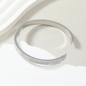 Elegant silver titanium steel bangle with three rows of sparkling pave crystals