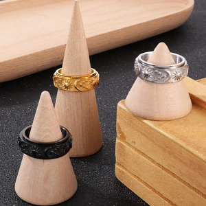 Rotating stainless steel spinner ring set with sun moon and star celestial patterns