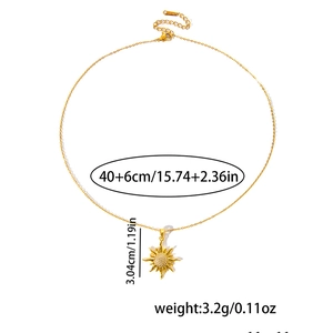 Detailed view of gold sun pendant necklace with dimensions 40+6cm and 3.04cm size