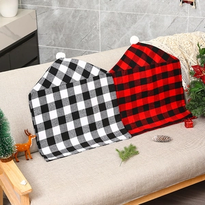Christmas buffalo plaid chair covers with white pom-poms for festive home decor