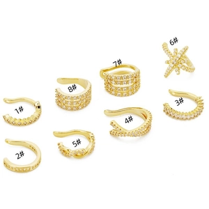 Set of 8 gold U-shaped ear cuffs featuring sparkling cubic zirconia and star designs