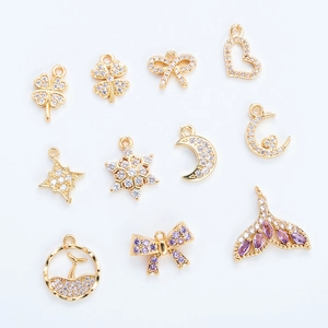 Golden 18K plated DIY jewelry charms with zircon in clover, bow, and star shapes