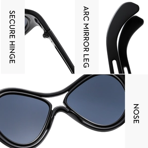 Detail view of large frame sunglasses showing secure hinges, arc legs, and nose pads